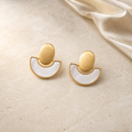 Ivory Eclipse Earrings gold and mother-of-pearl flat lay