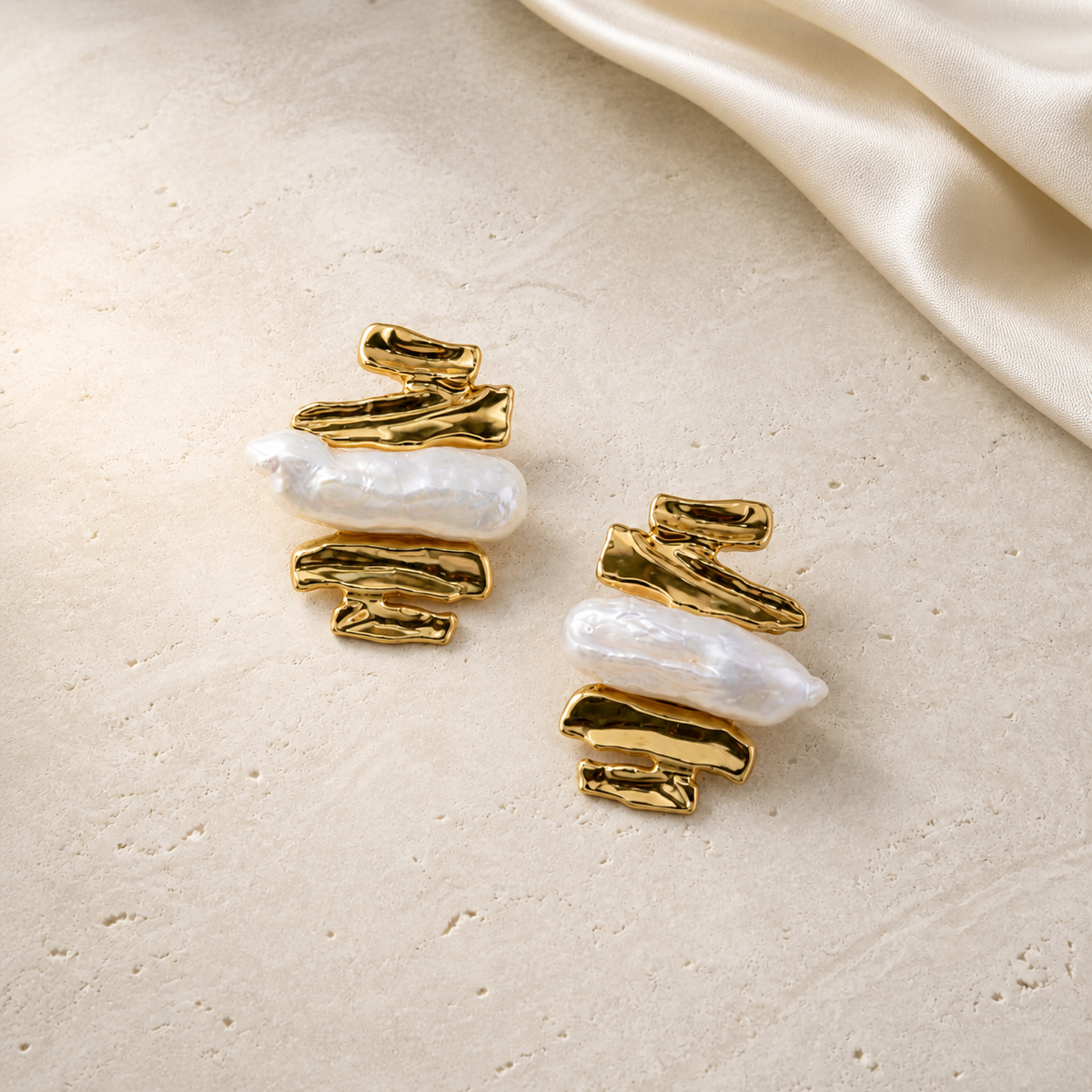 Molten Pearl Earrings gold and baroque pearl flat lay