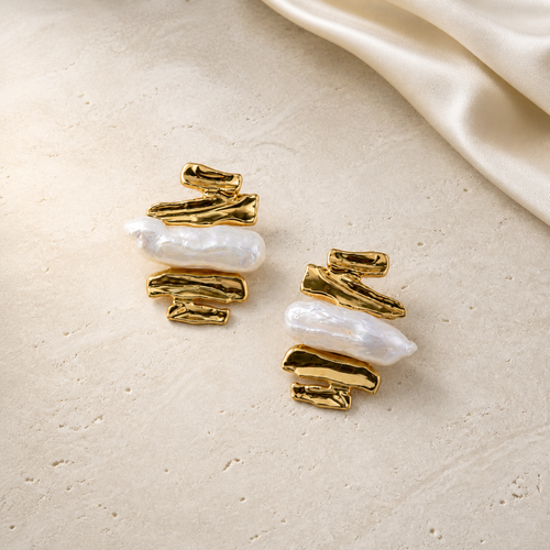 Molten Pearl Earrings gold and baroque pearl flat lay