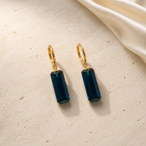 Midnight Prism Earrings gold hoops with deep blue crystal drops
