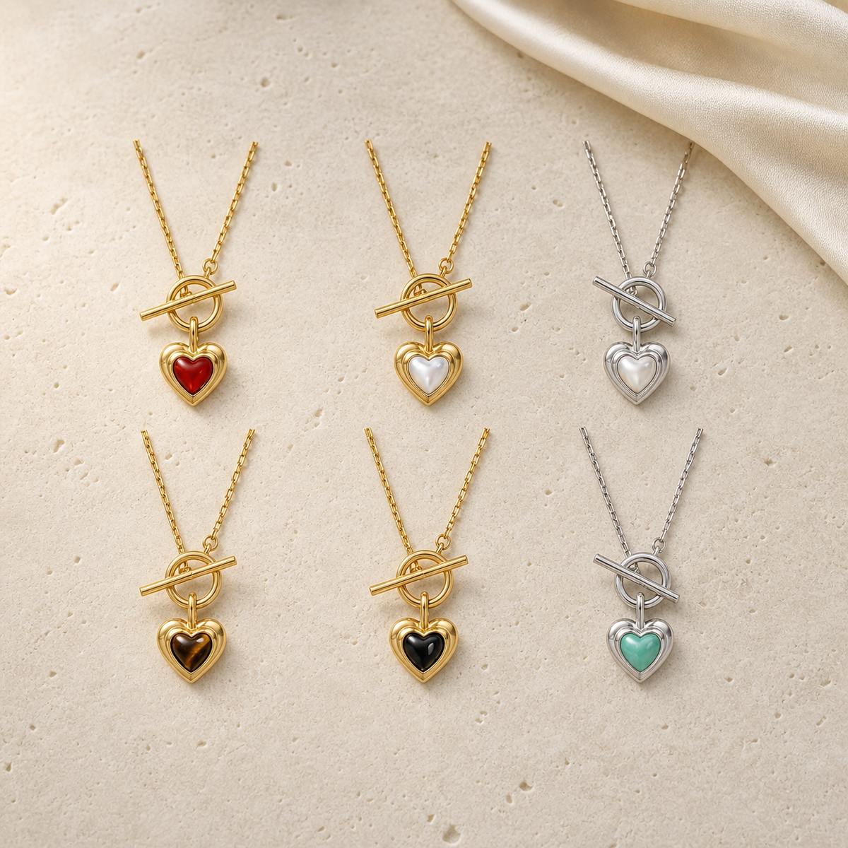The Heart Within Necklace colour variants flat lay