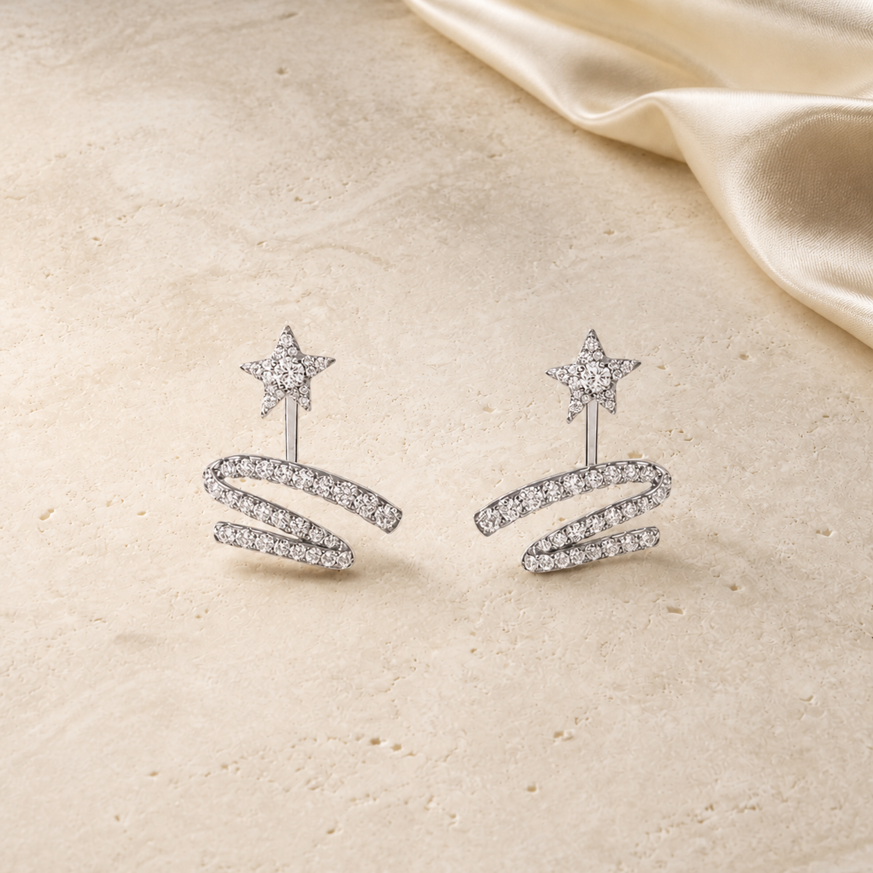 Silver starlight zircon earrings on ivory travertine