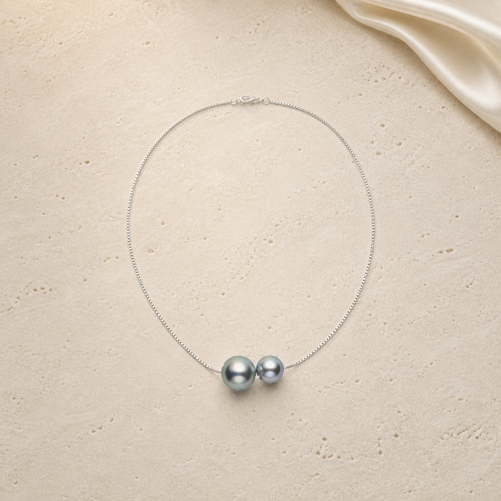 Fortune and Prosperity Gourd Pearl Necklace on warm ivory travertine