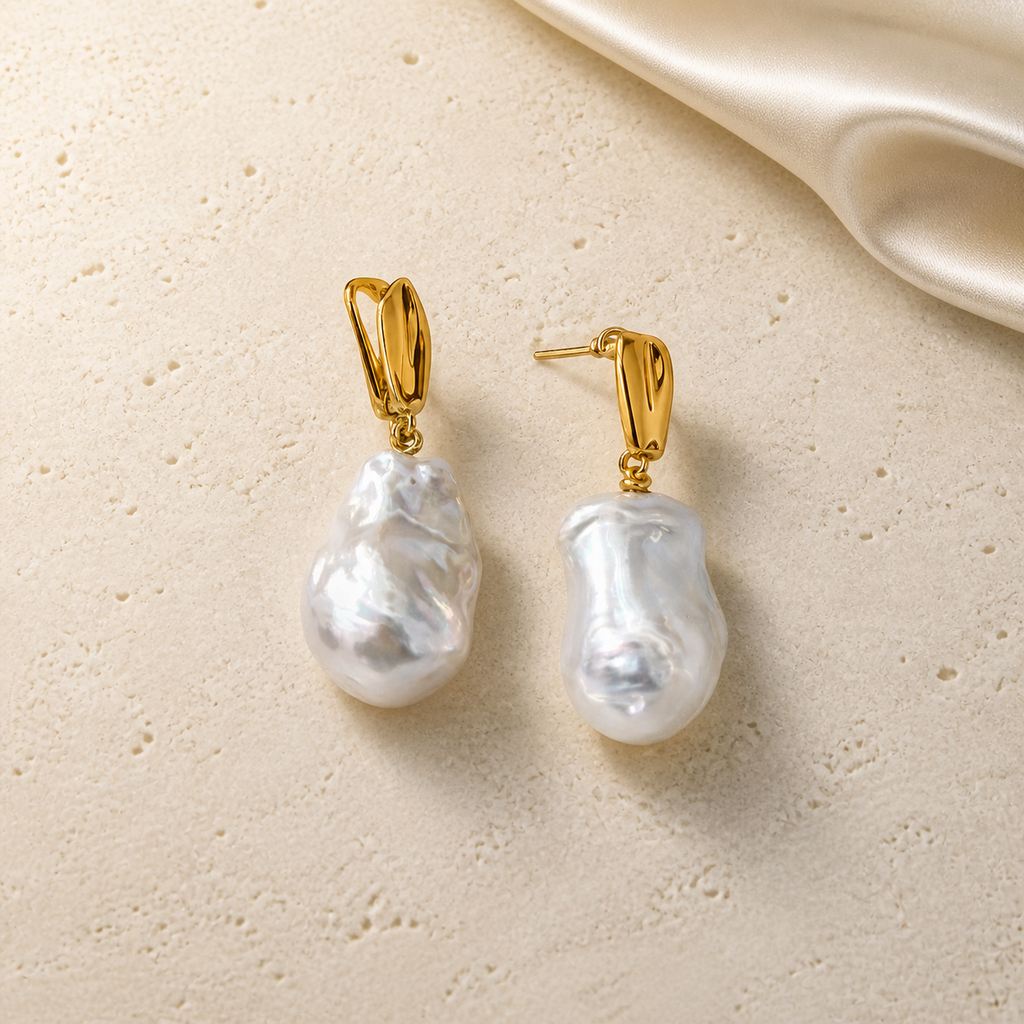 Baroque Oversized Hoop Earrings on warm ivory travertine