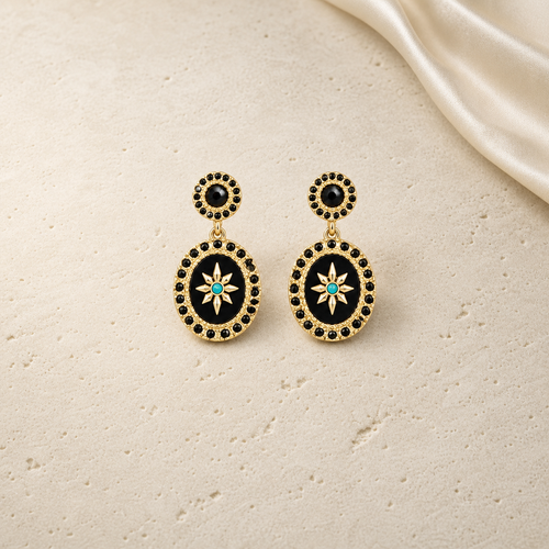 Vintage Black Mirror Medallion Drop Earrings on warm ivory travertine