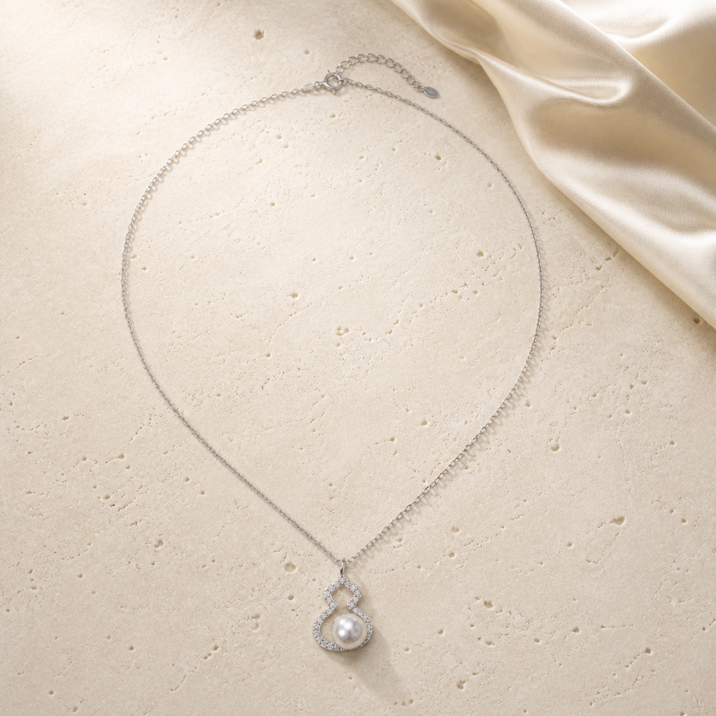 2026 Lucky Hulu Pearl Necklace on warm ivory travertine