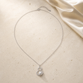 2026 Lucky Hulu Pearl Necklace on warm ivory travertine