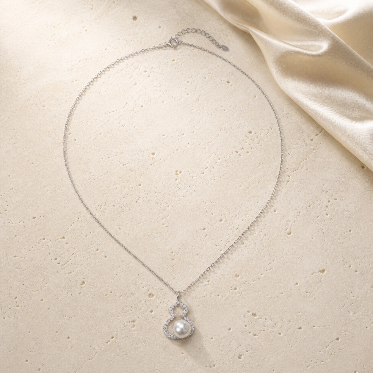 2026 Lucky Hulu Pearl Necklace on warm ivory travertine