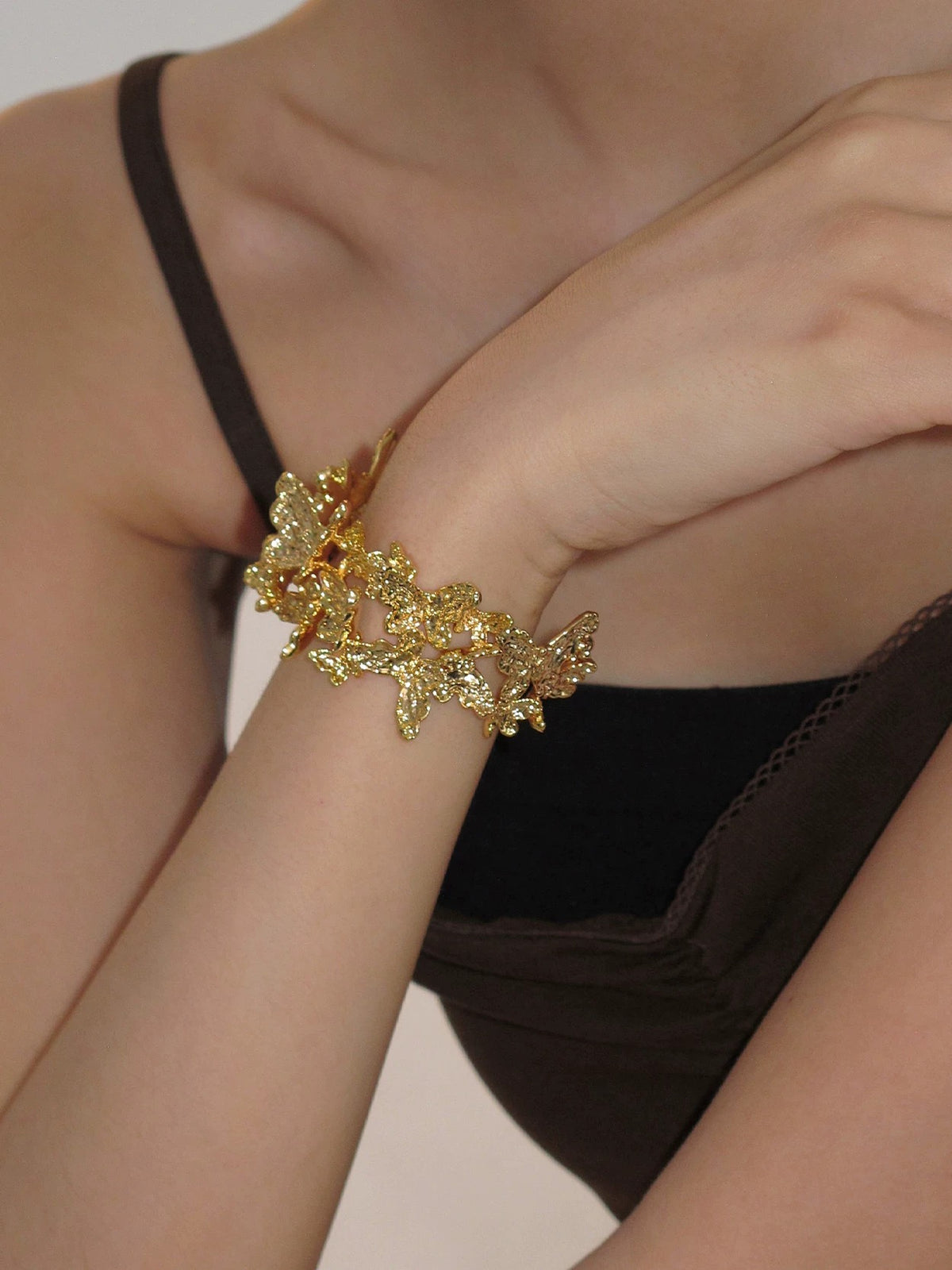 Gold butterfly textured statement bracelet