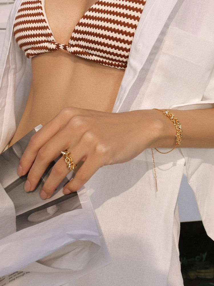 Gold disc bracelet with cubic zirconia