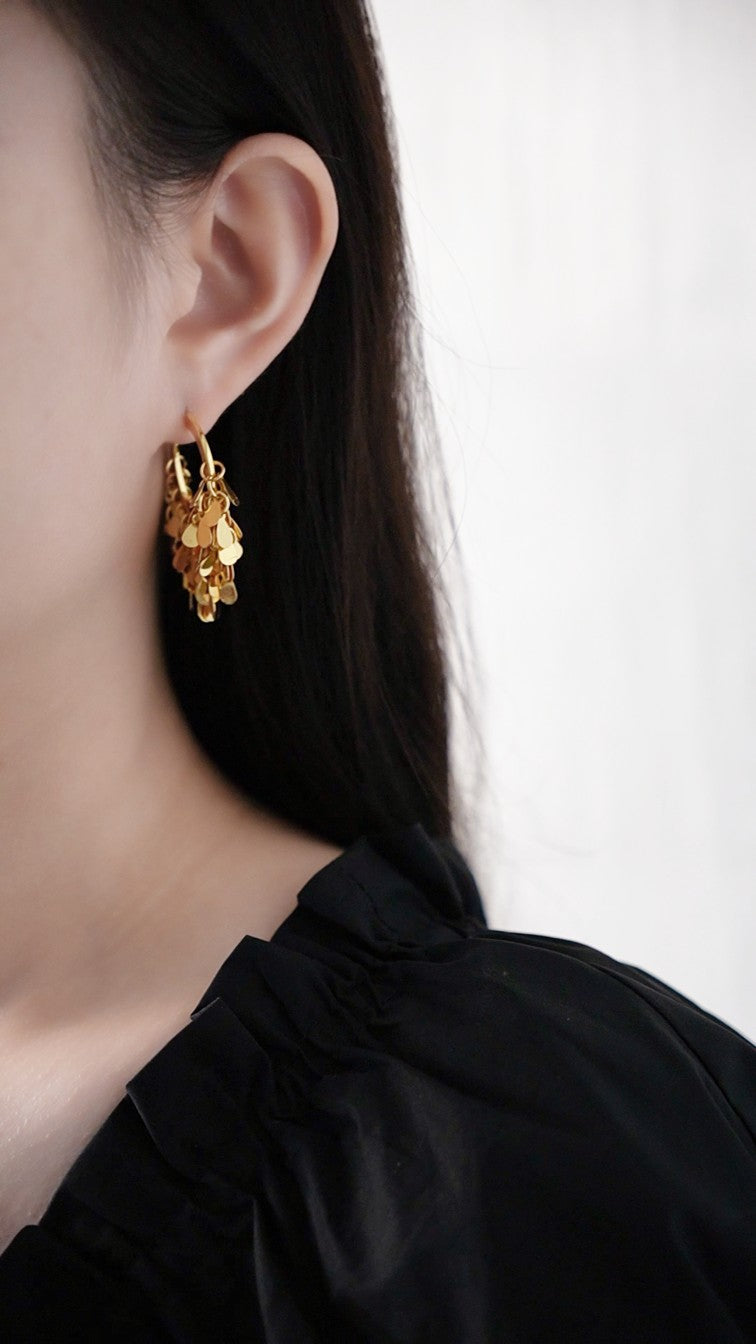Gold hoop earrings with cascading drops