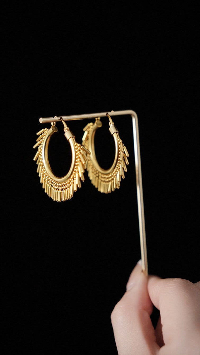 Gold sculpted statement hoop earrings