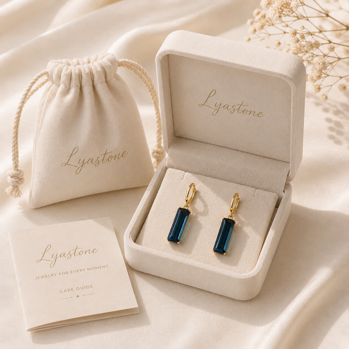 Deep blue crystal and warm gold-tone finish detail on Midnight Prism Earrings