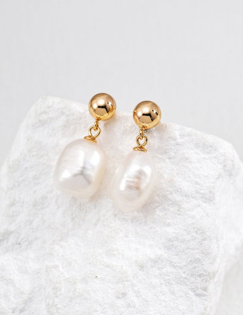 Irregular pearl earrings in antique gold