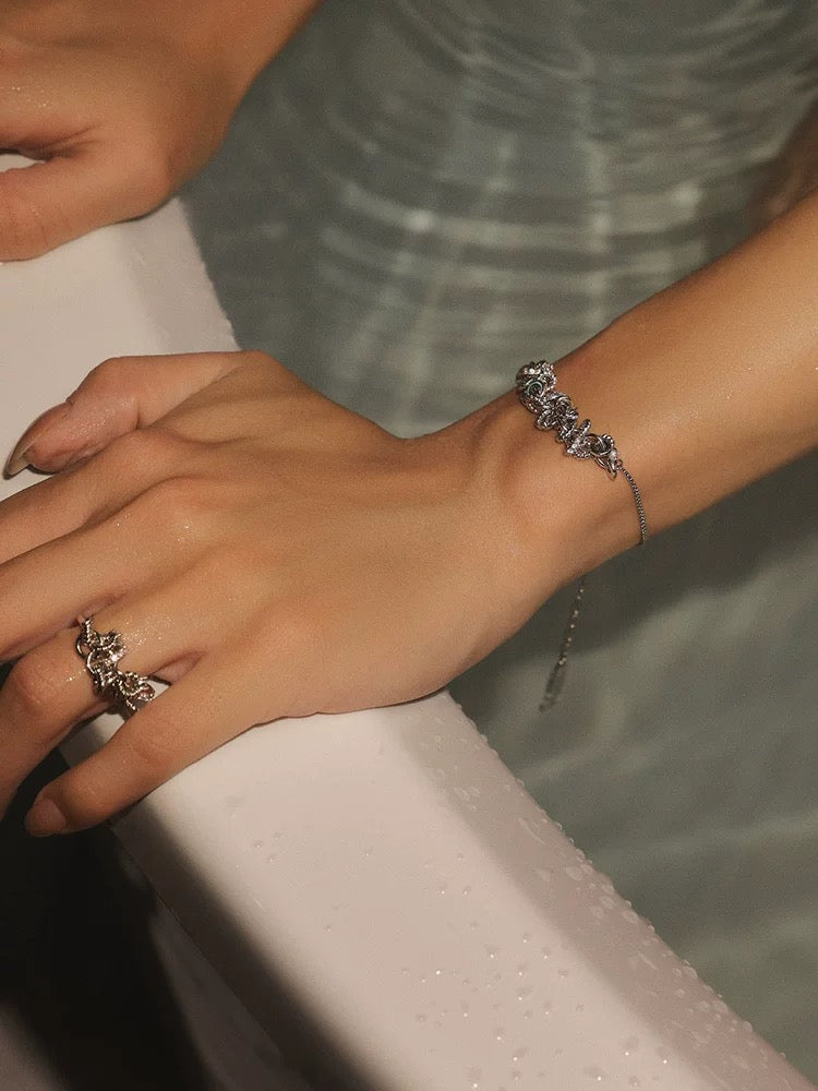 Platinum disc bracelet with zirconia