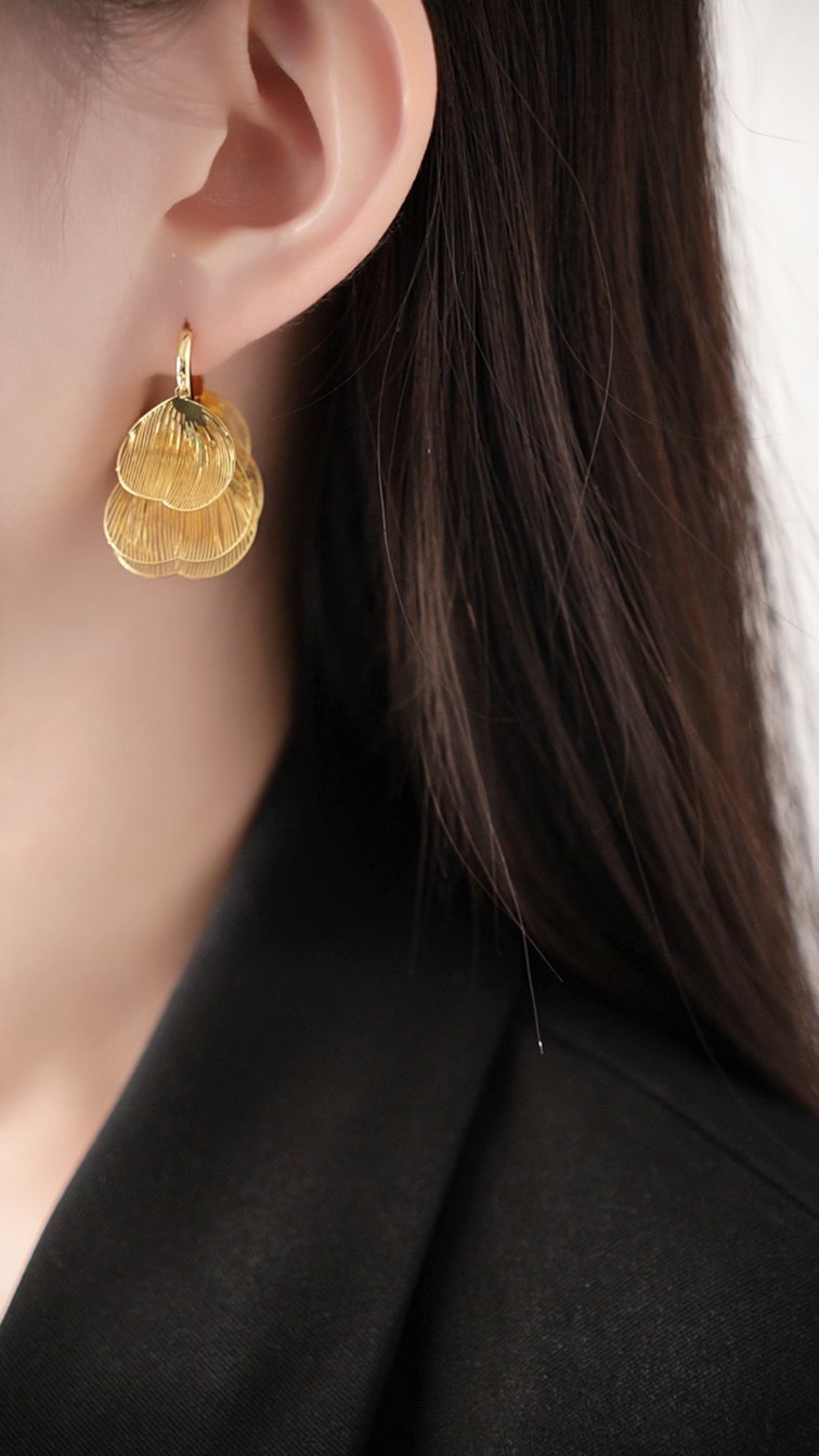 Sculpted metal statement earrings in gold