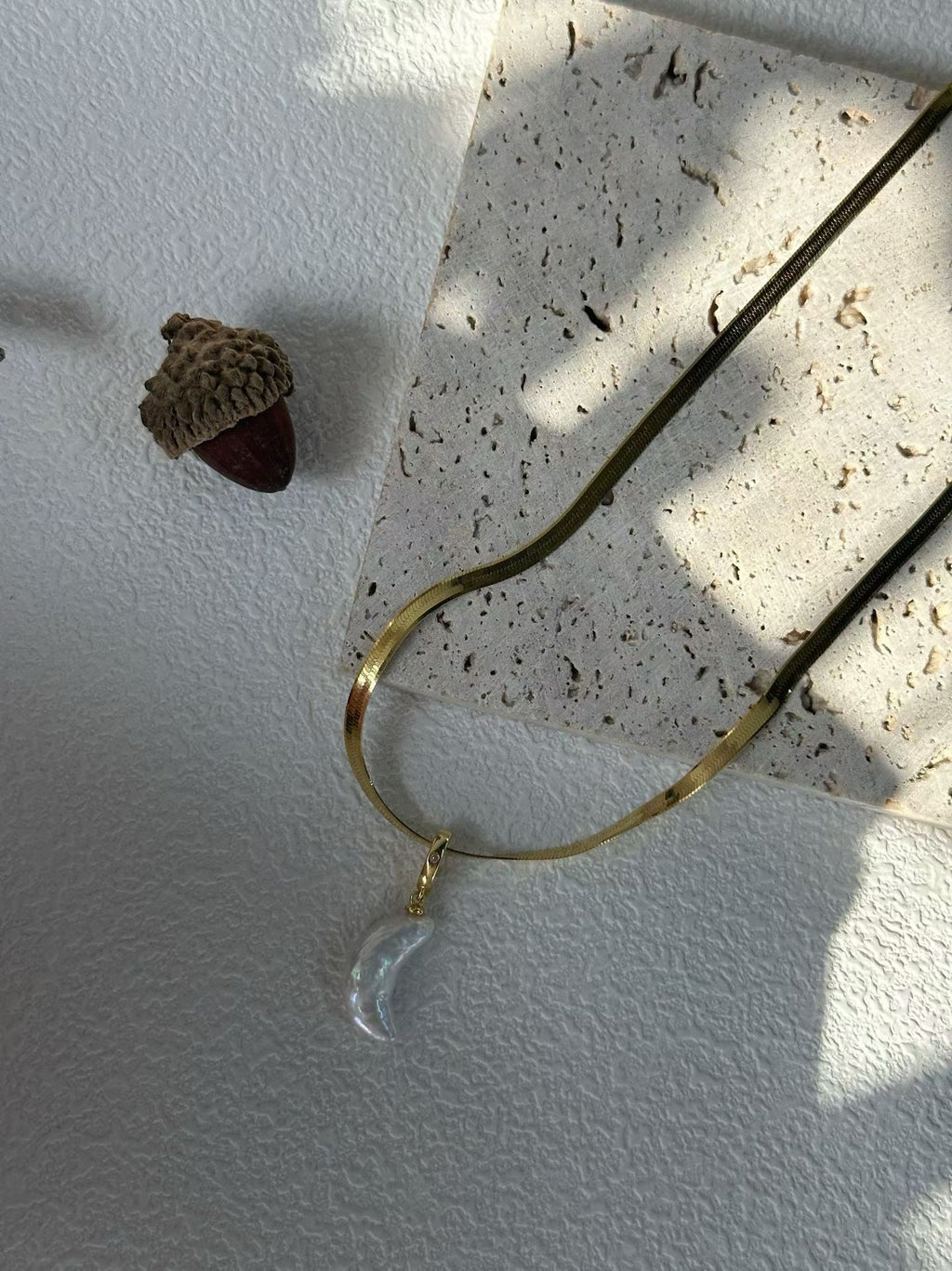 Symbolic moon necklace