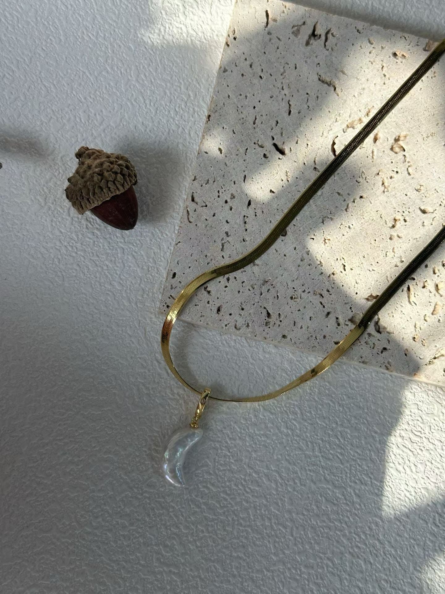 Symbolic moon necklace