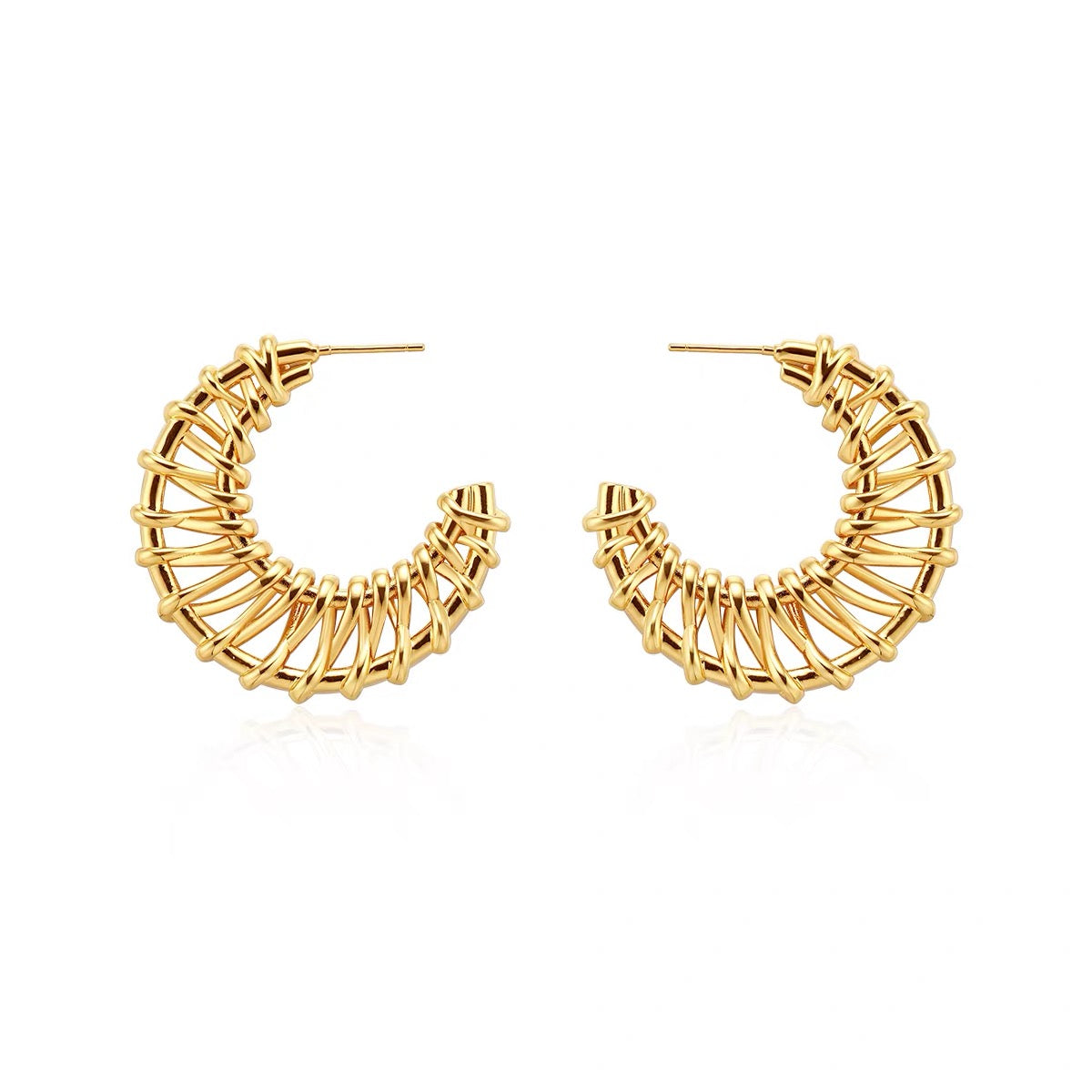 Woven statement earrings in gold