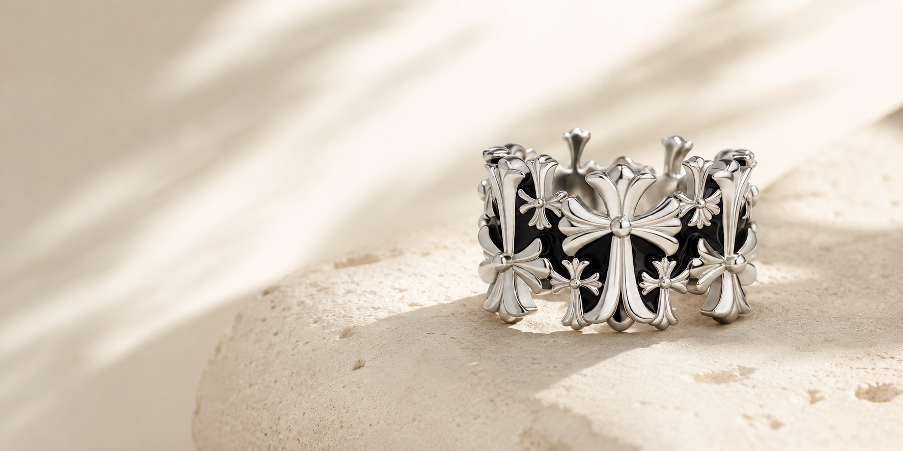 Lyastone Aster Cross Open Ring on warm travertine in natural light