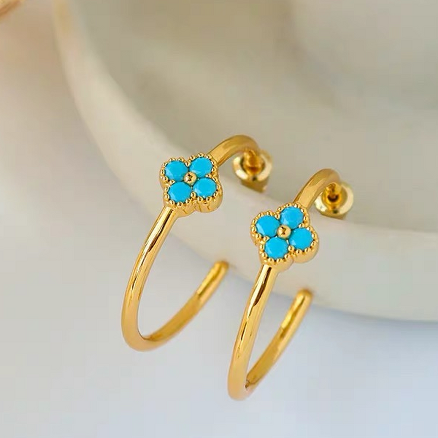 Close-up of Azure Bloom Gold Hoop Earrings showing four turquoise-blue stones, gold centres and beaded edging.