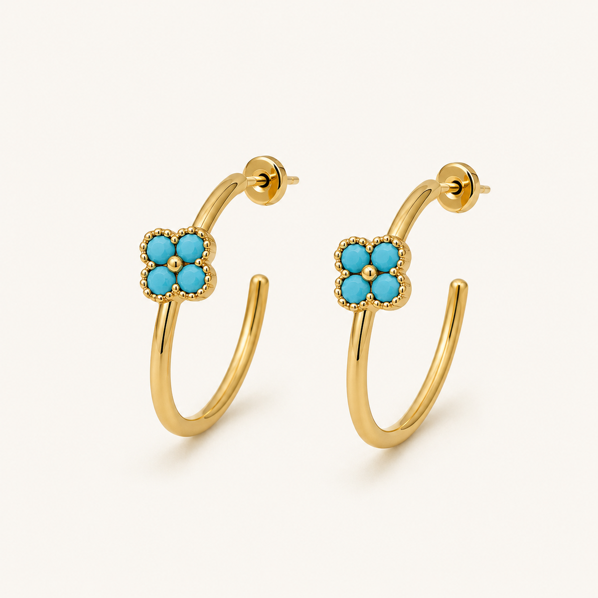 Azure Bloom Gold Hoop Earrings pair on a clean ivory background showing the polished gold-tone hoops.