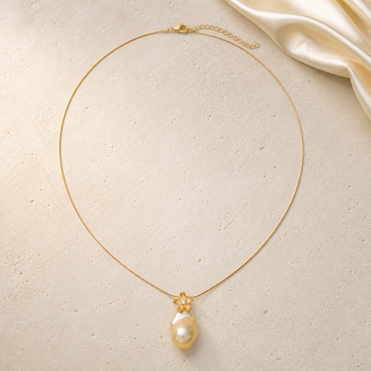 Baroque Pearl Flower Necklace on warm ivory travertine