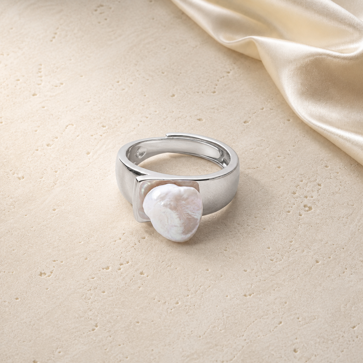 Baroque Pearl Ring on warm ivory travertine