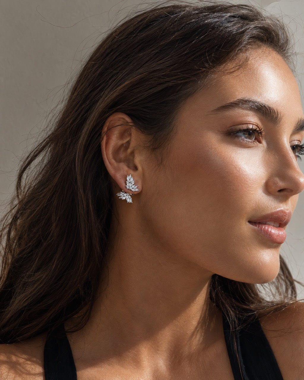 Model wearing Lyastone butterfly zircon stud earrings