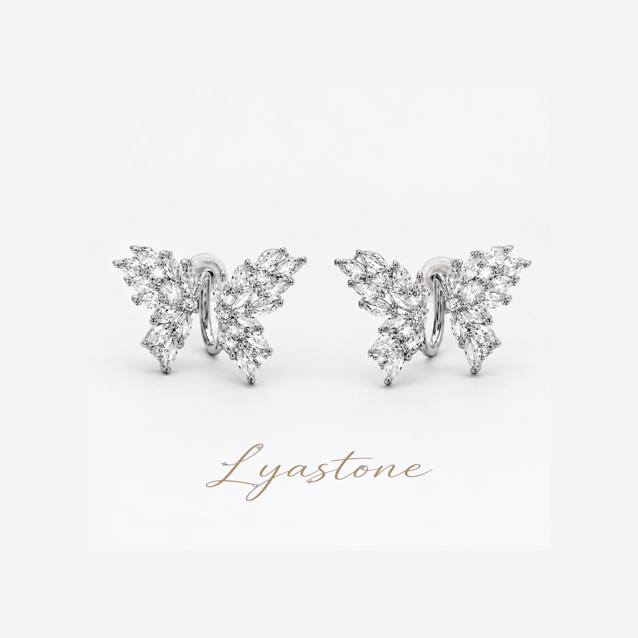 Lyastone butterfly zircon stud earrings in white-gold tone