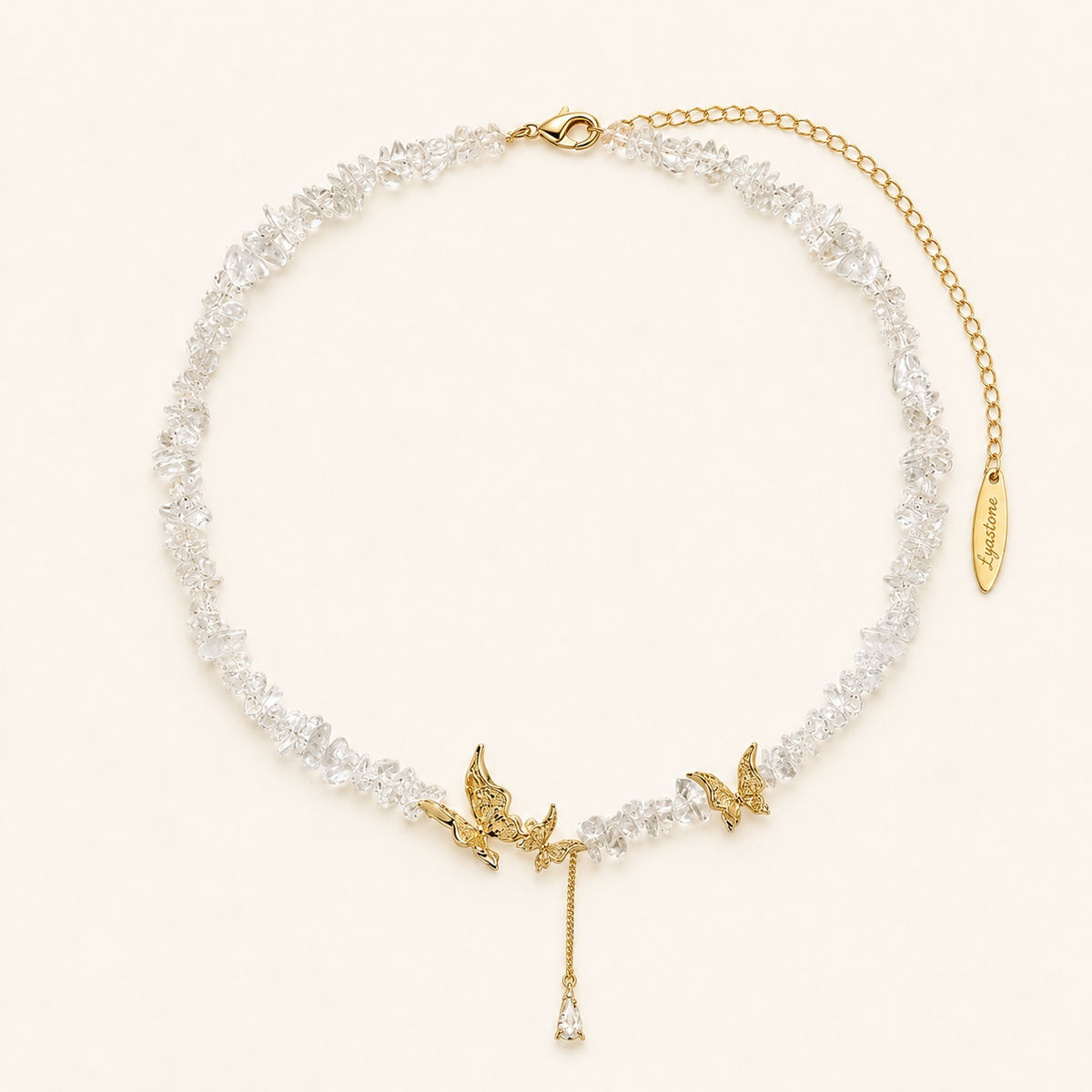 Gold tone crystal butterfly necklace with clear chips and Lyastone tag.