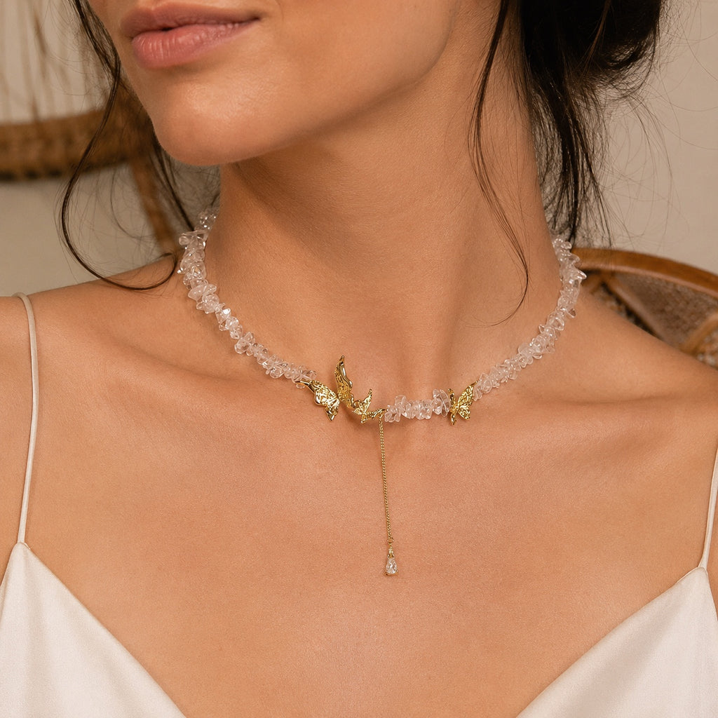 Model wearing the gold tone crystal butterfly necklace.