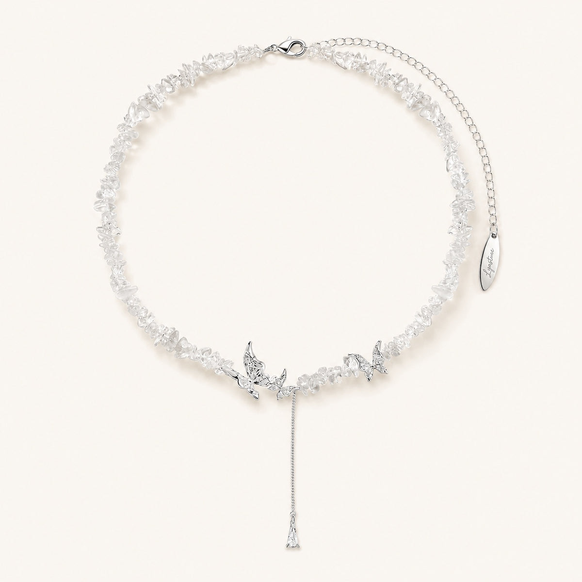 Silver tone crystal butterfly necklace with clear chips and Lyastone tag.