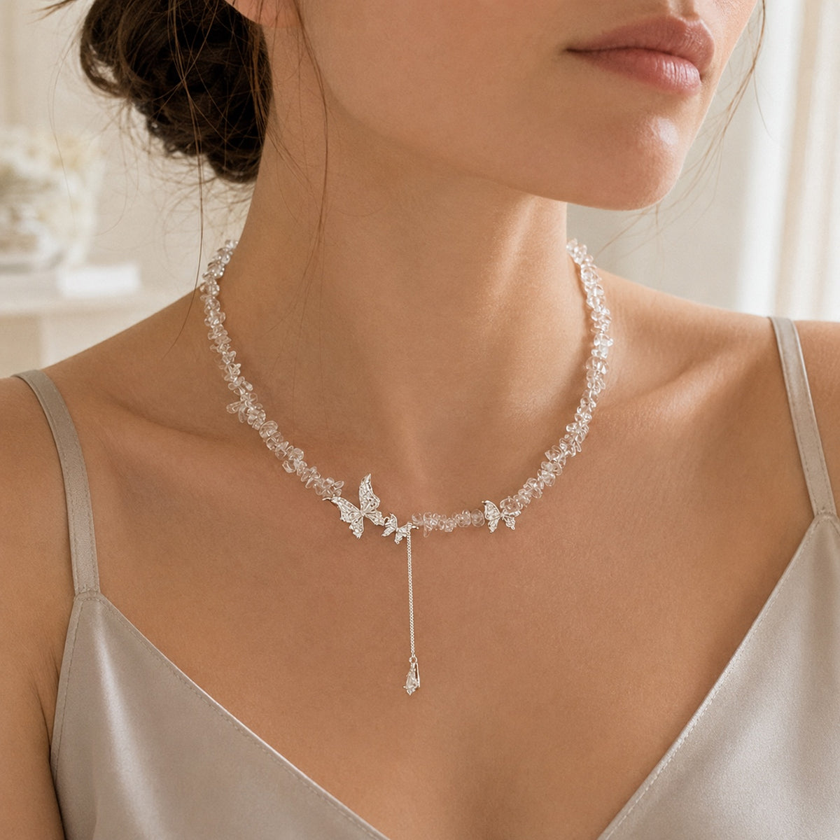 Model wearing the silver tone crystal butterfly necklace.