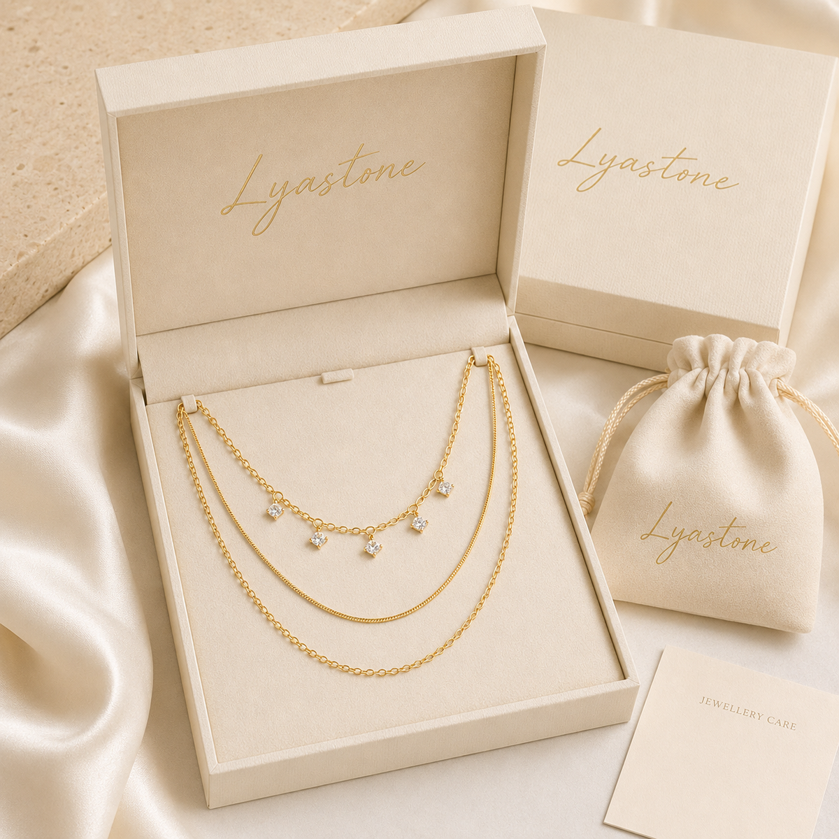Elara gold-tone layered necklace presented in Lyastone gift packaging