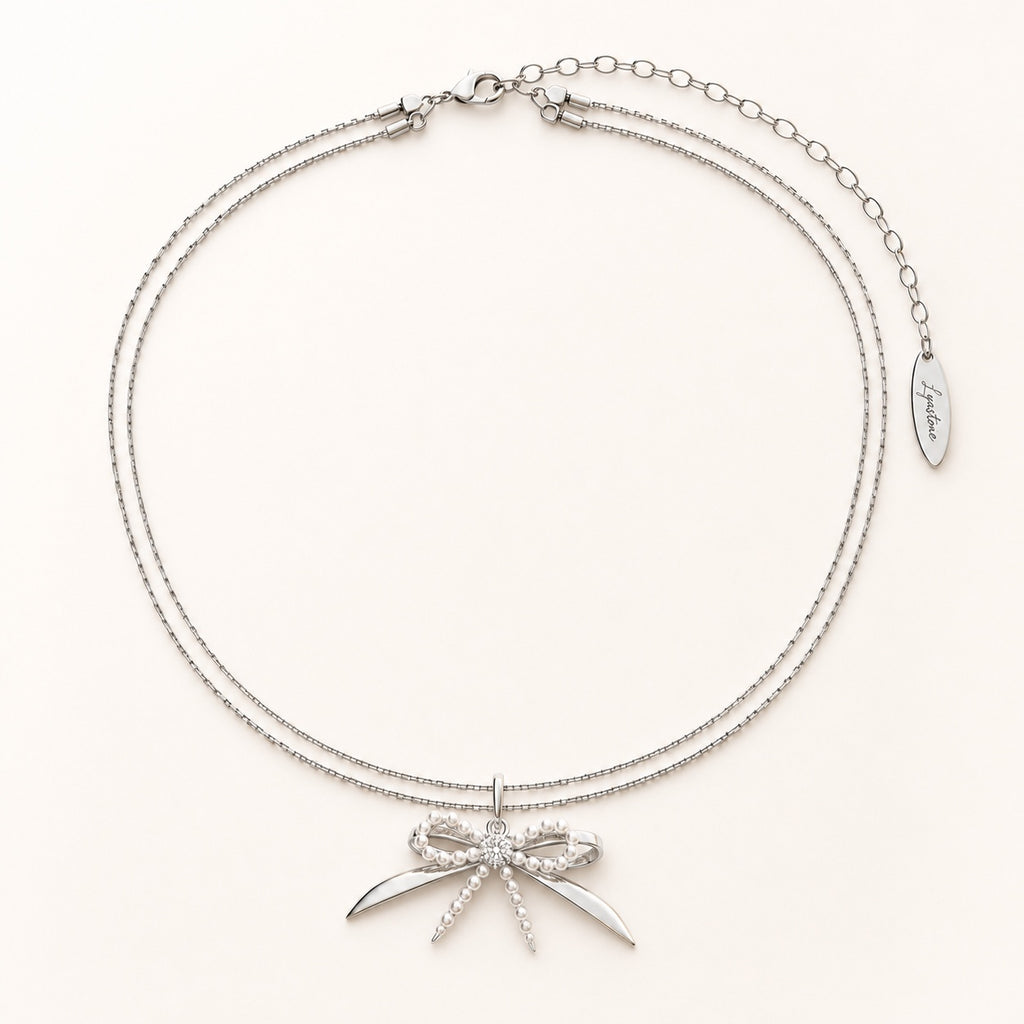 Élodie silver pearl bow necklace editorial still life