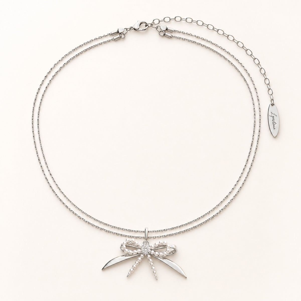 Élodie silver pearl bow necklace editorial still life