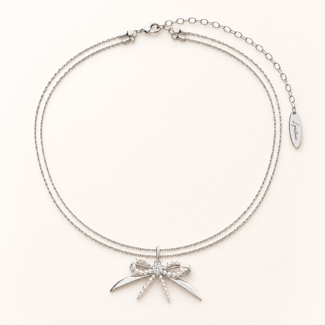 Élodie silver pearl bow necklace editorial still life