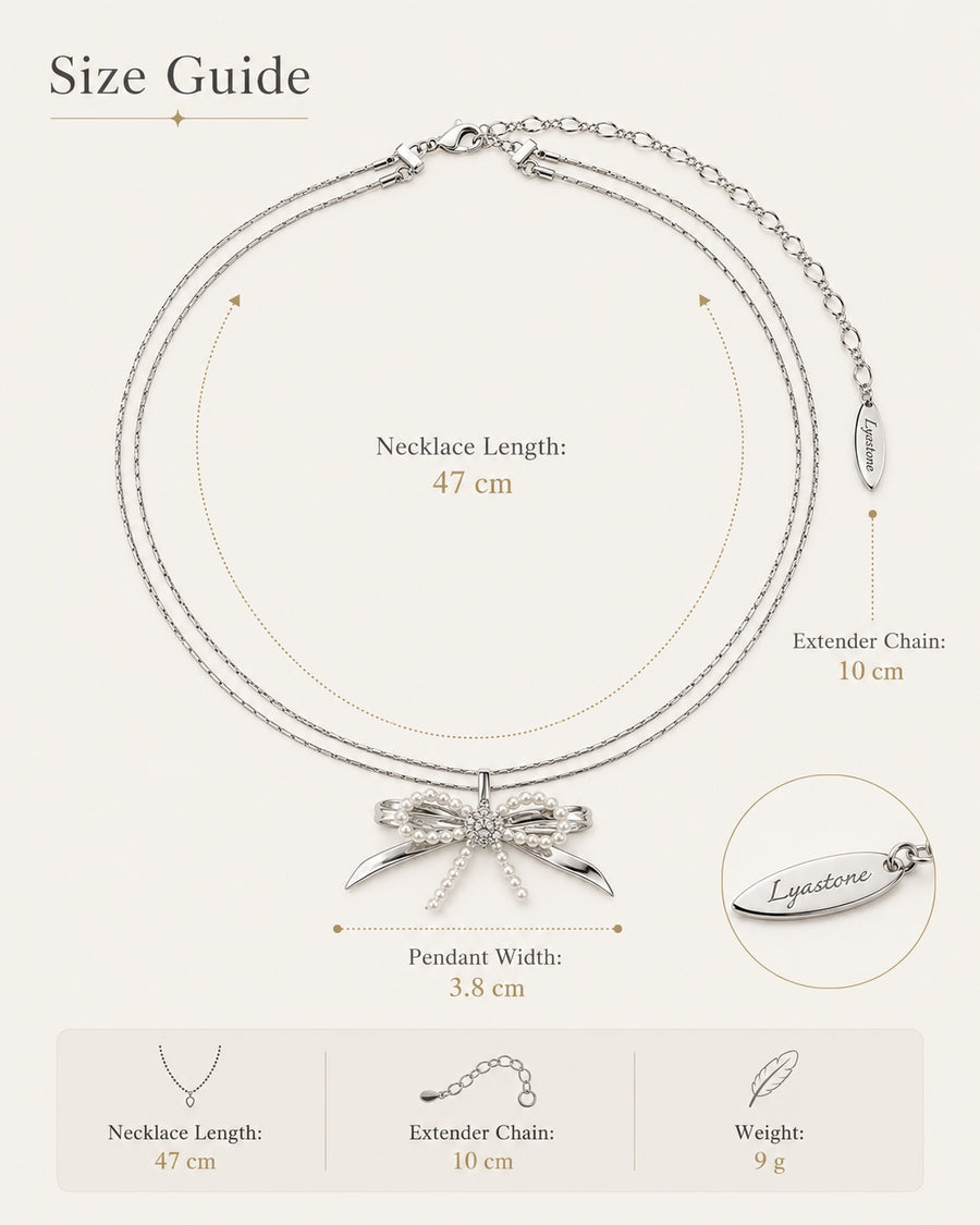 Élodie pearl bow necklace size guide 47 cm chain, 10 cm extender, 3.8 cm pendant