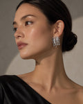 Silver Handwoven Asymmetric Stud Earrings worn by a model