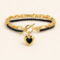 Gold-tone Amoura Heart Toggle Bracelet with black agate beads
