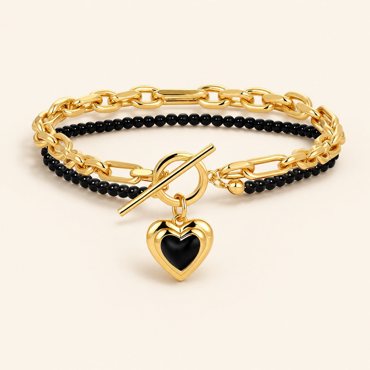 Gold-tone Amoura Heart Toggle Bracelet with black agate beads