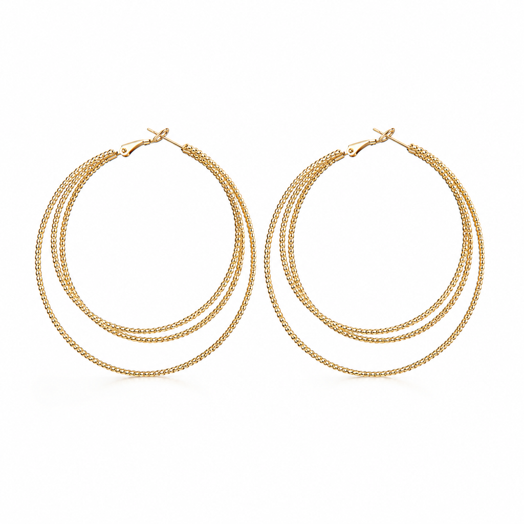 Aurelia triple hoop earrings in gold on a clean white background