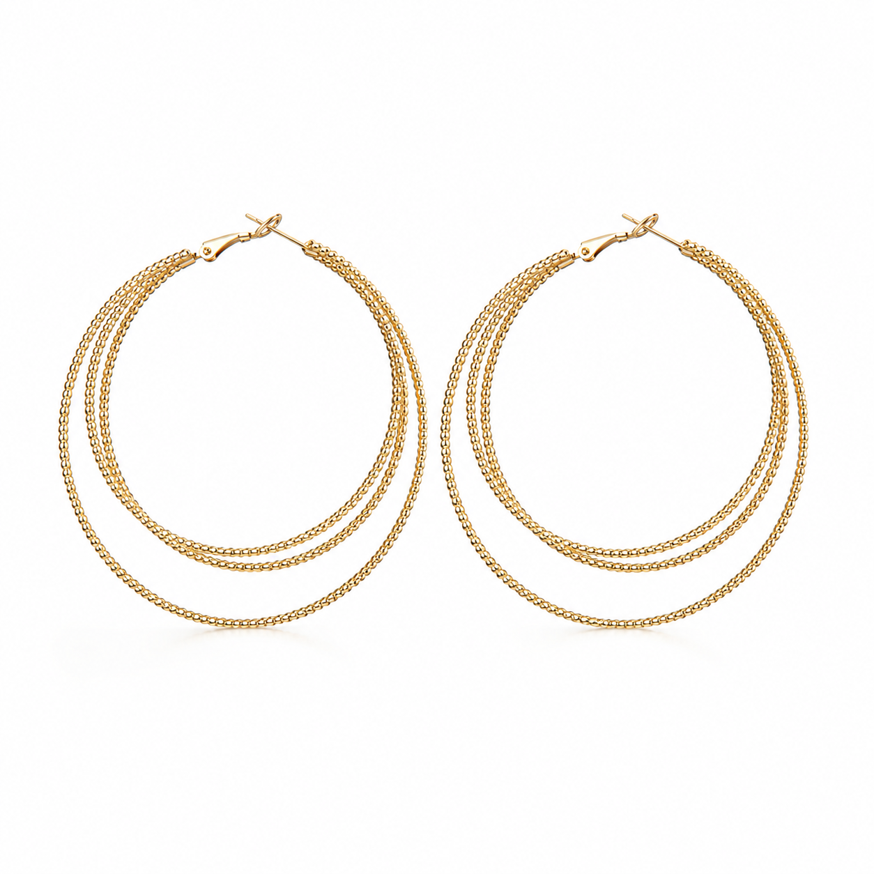 Aurelia triple hoop earrings in gold on a clean white background