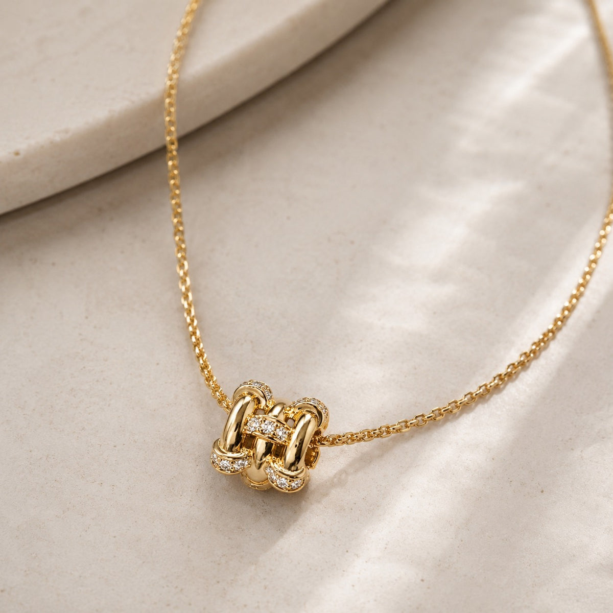 Close up of Eternal Link Necklace pendant with cubic zirconia detail