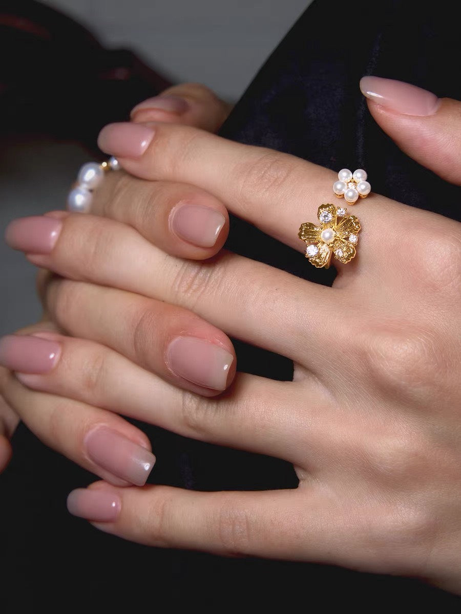 Golden Bloom Pearl Ring styled on hand with pearl flower detail