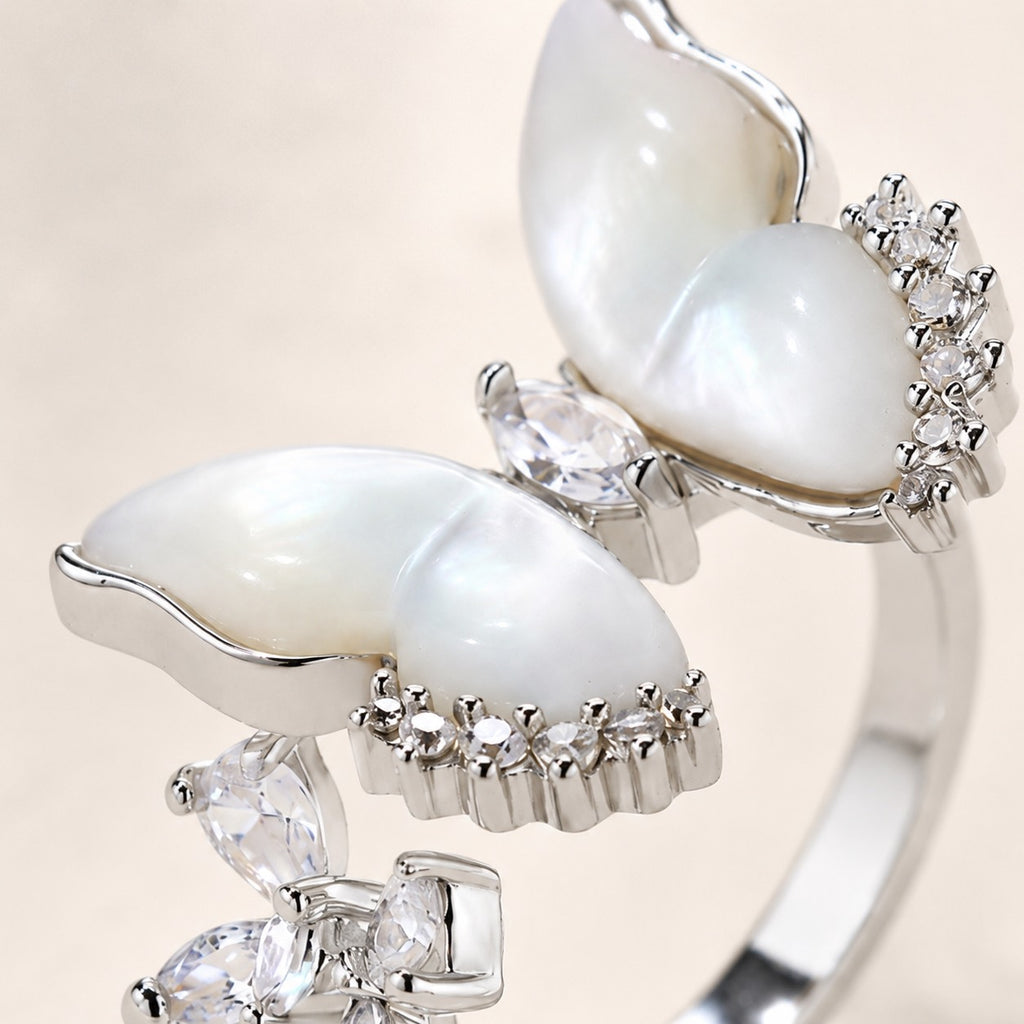 Close up of Moonveil Butterfly Ring with white mother of pearl wings and cubic zirconia accents