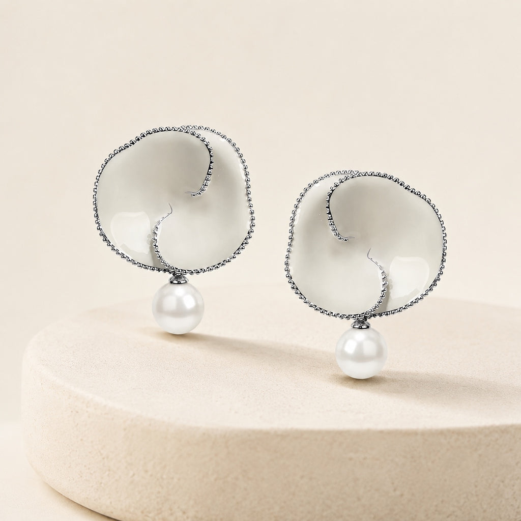 Nacre Bloom Earrings styled on warm ivory stone
