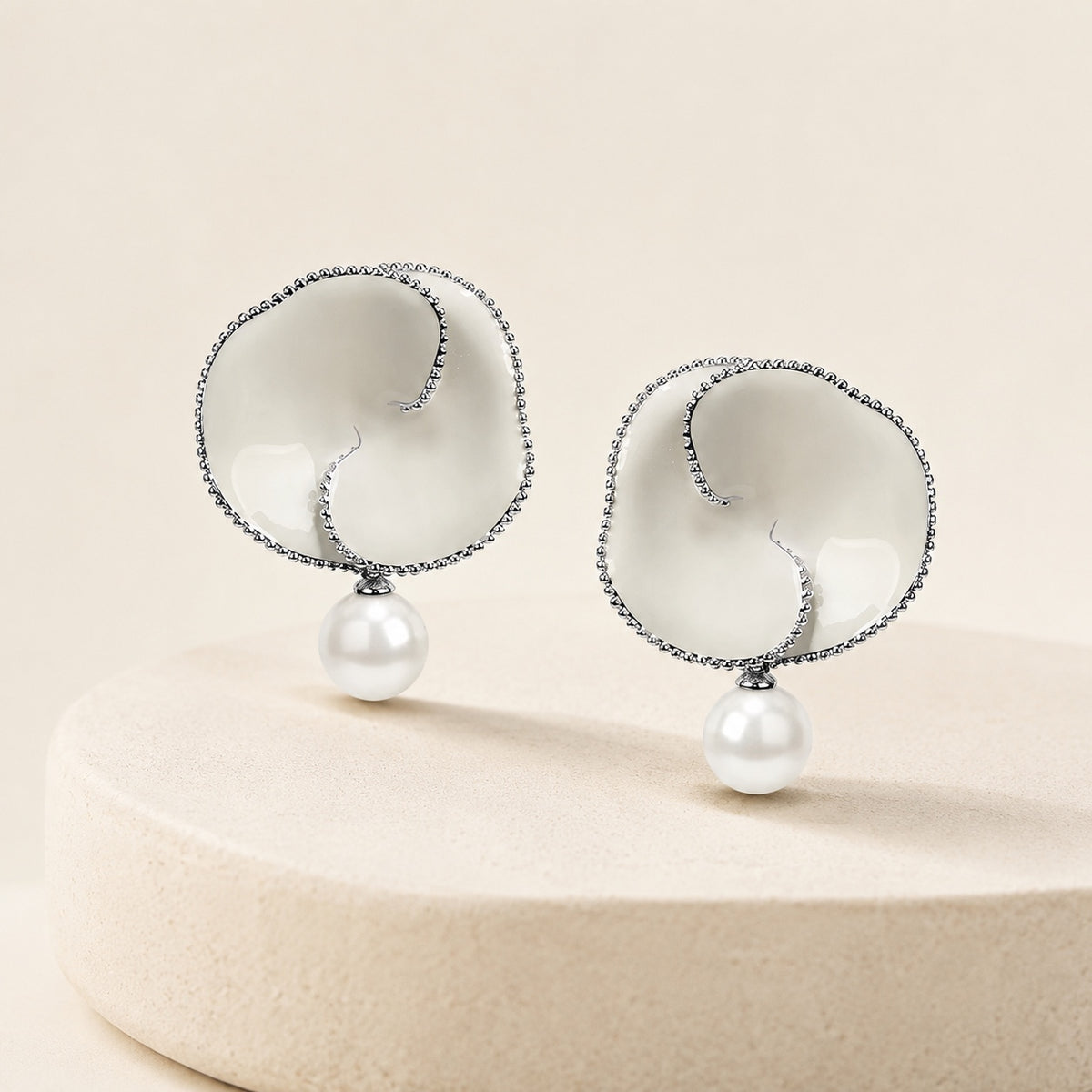 Nacre Bloom Earrings styled on warm ivory stone
