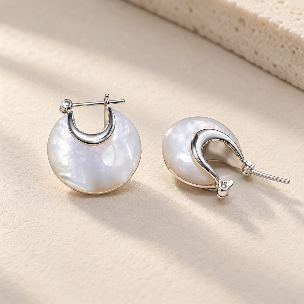 Close-up of 925 sterling silver and white mother-of-pearl Nacre Disc Hoop Earrings